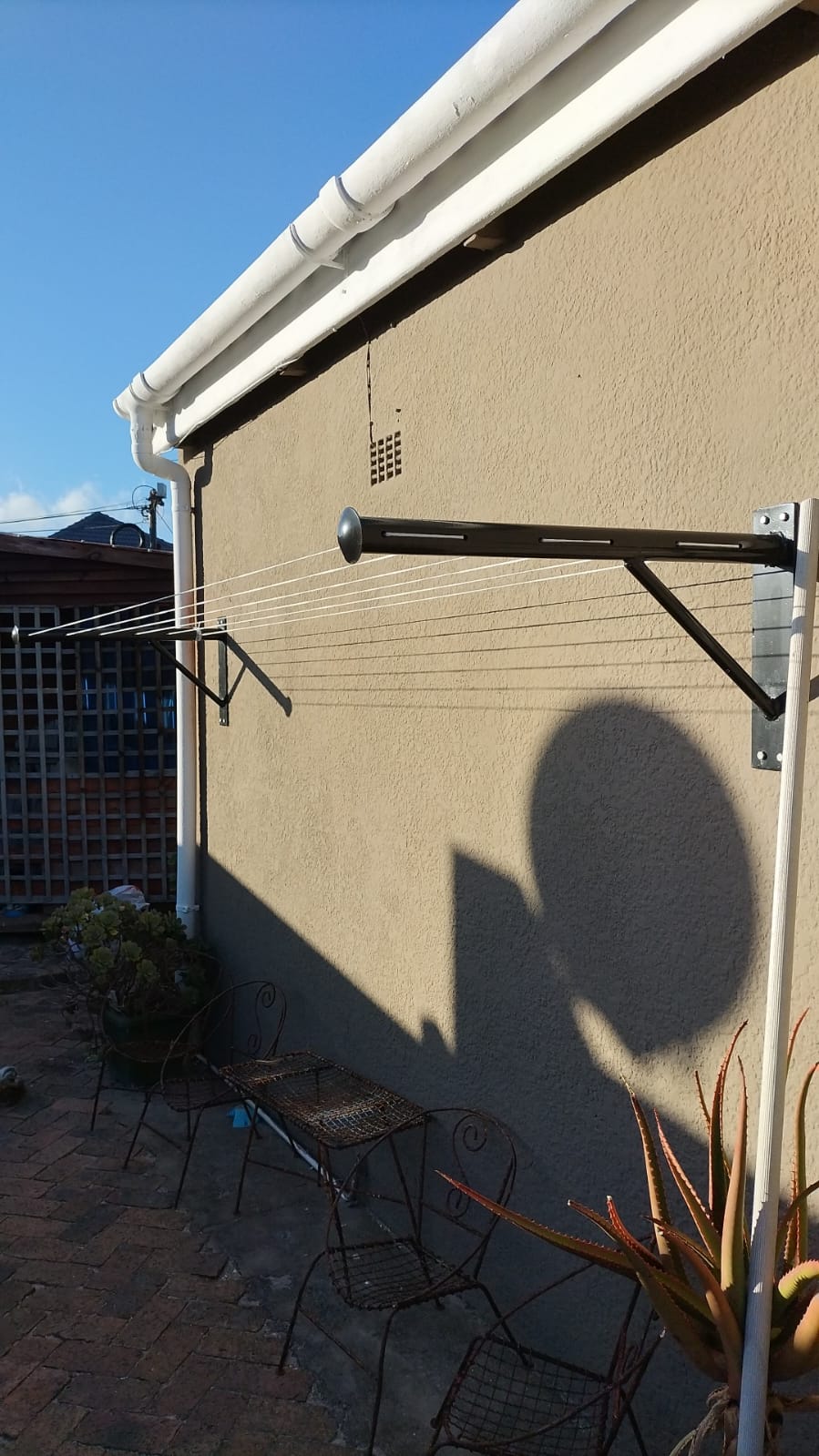 Wall mounted T-Piece.  Does not fold down.  Any length.